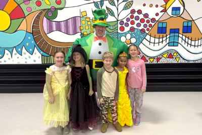 Mr. Nelson posing with WES students for fairy tale day